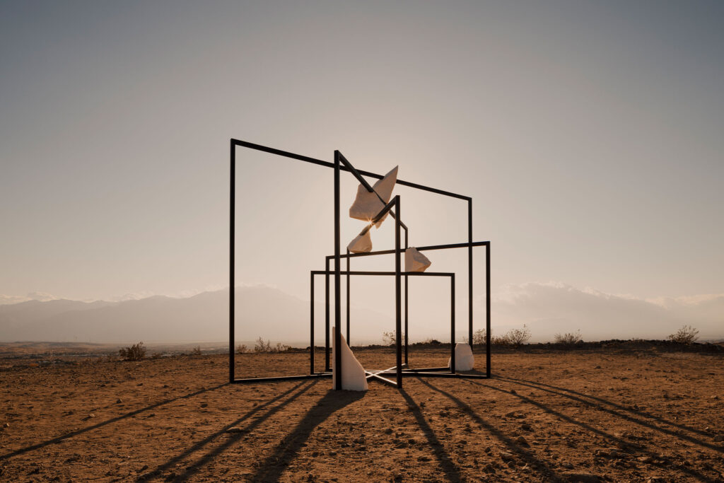 Artist Alicja Kwade investigates the boundaries between the natural and the constructed, inviting viewers to reconsider their place within vast systems of time, matter, and ultimately meaning. Working with materials like stone, metal, and glass, her practice is a collaboration with the earth itself. She talks to Anna Borrie about her sculptures that challenge our human assumptions about permanence, value, and truth. Digging into how her work exposes the quiet absurdities and inherited beliefs that shape our understanding of the universe. She urges us to see with greater humility and curiosity and to have reverence for the interconnectedness of all beings. This interview is published by Planted Journal, a non-profit publication dedicated to bridging the gap between humans and nature for personal and planetary well-being.